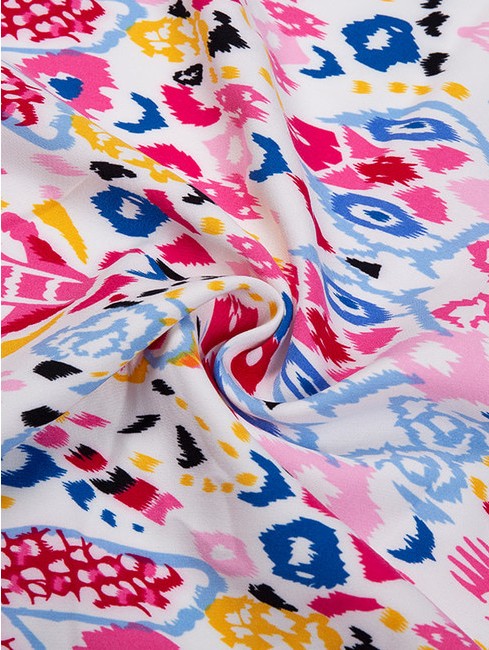 What factors contribute to the four-way elastic properties of Barbie Fabric?